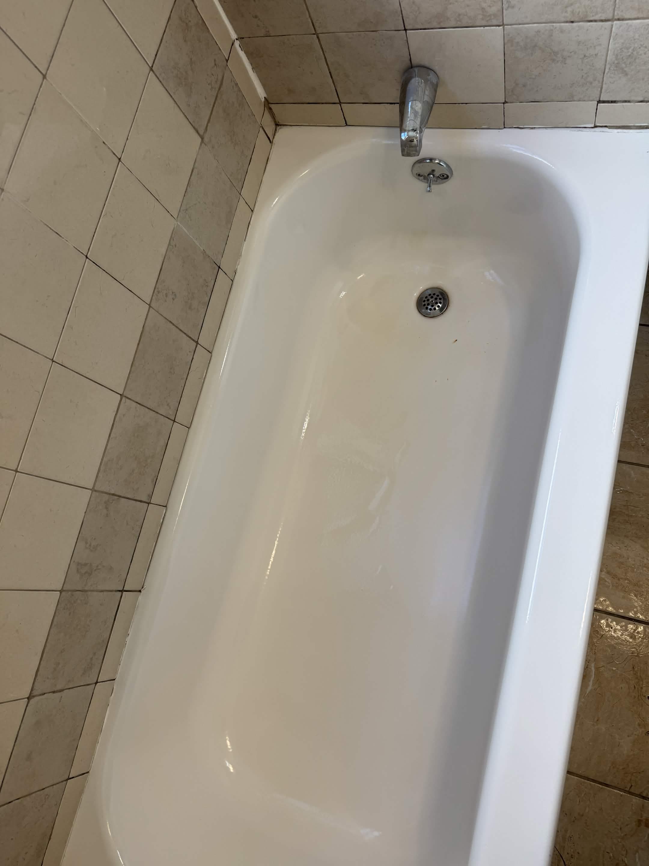 A freshly cleaned bathtub and tile